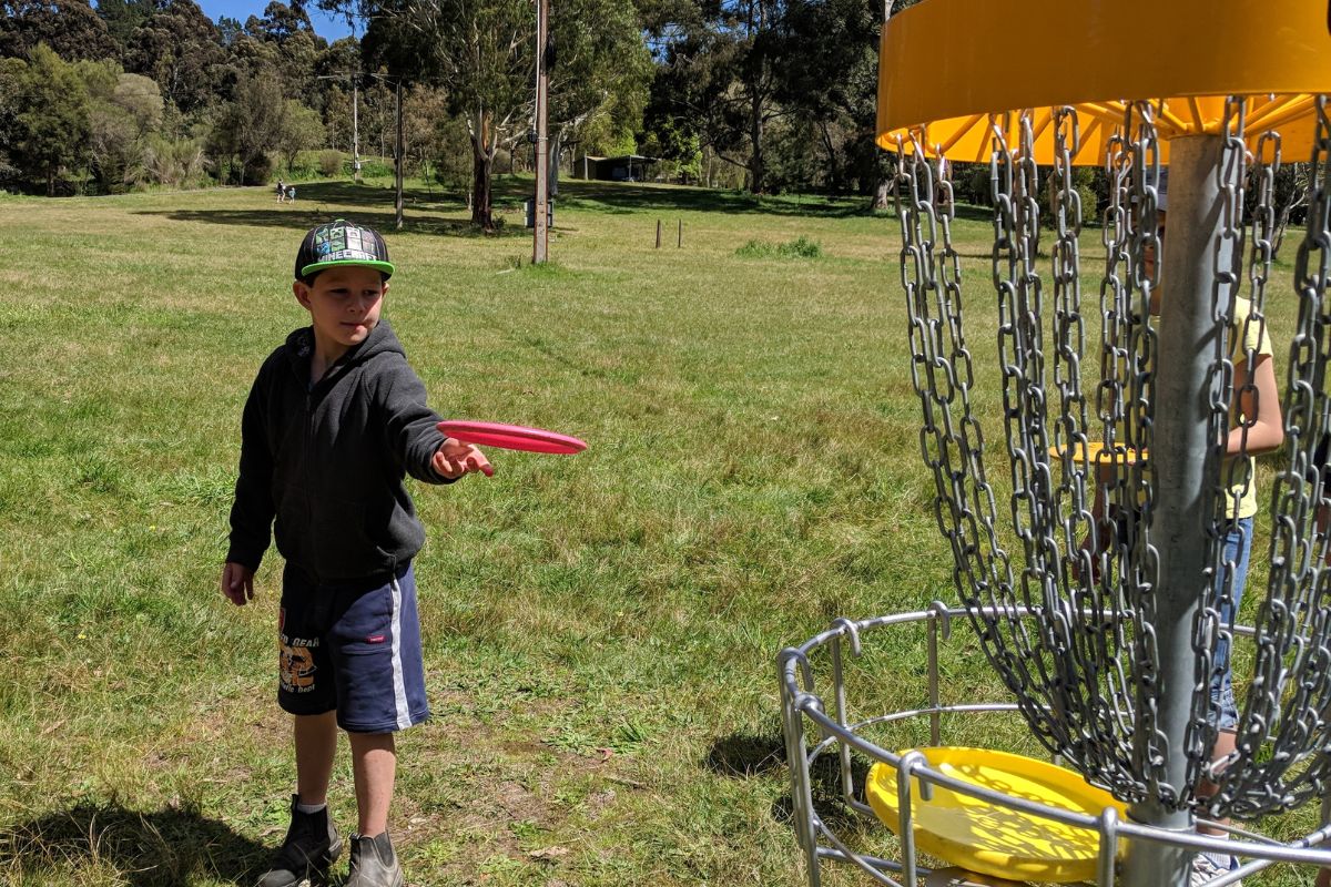 Students playing Disc Golf at Woodhouse