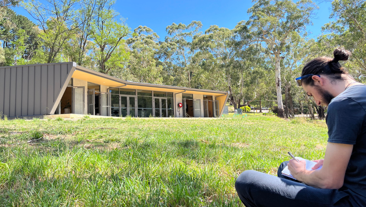 Participants connecting with nature during an outdoor wellbeing workshop at Woodhouse