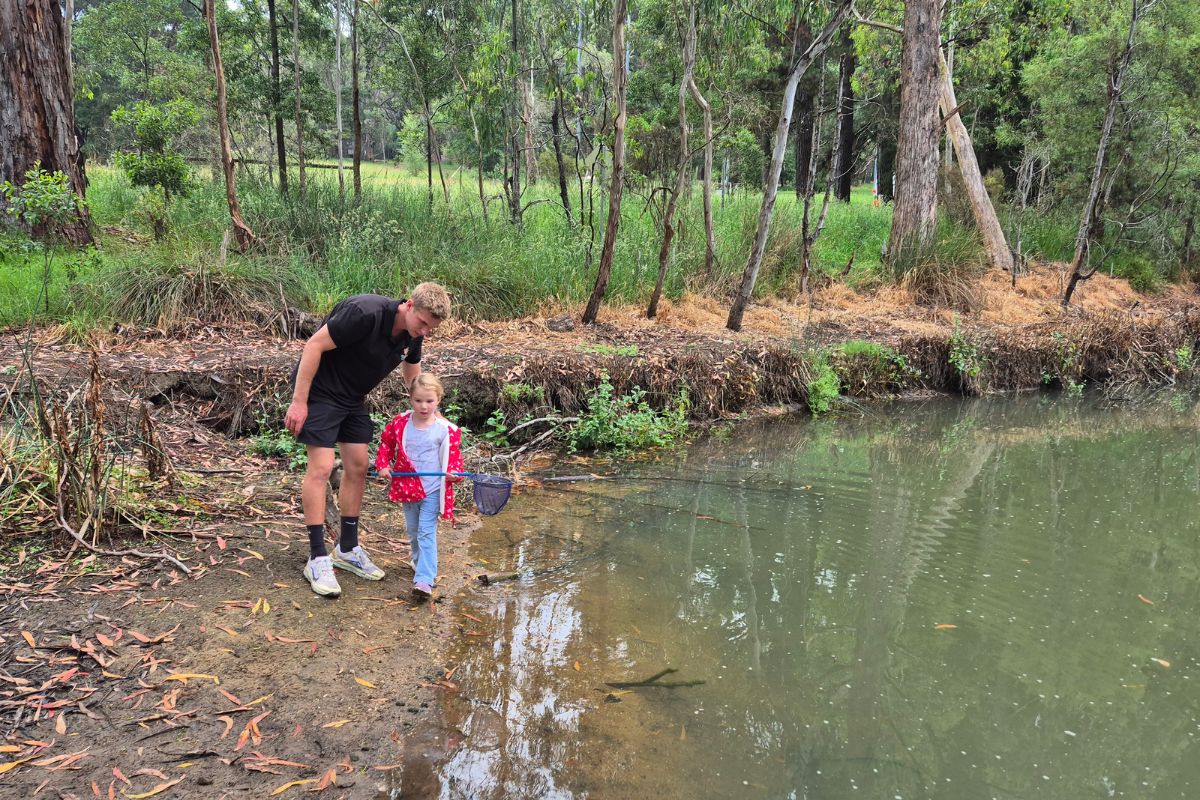 Children exploring pond life during a Seedlings excursion at Woodhouse