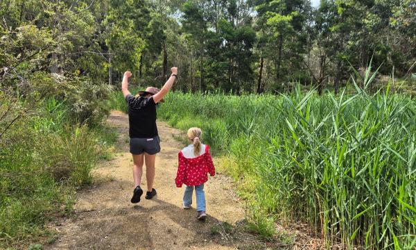 Family enjoying time together outdoors at Woodhouse Adventure Park
