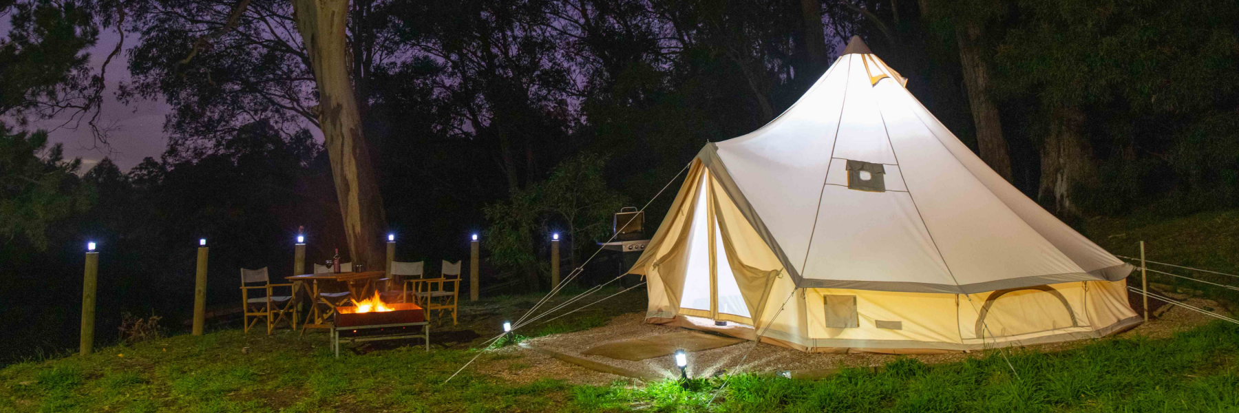Glamping Website Header with Campfire